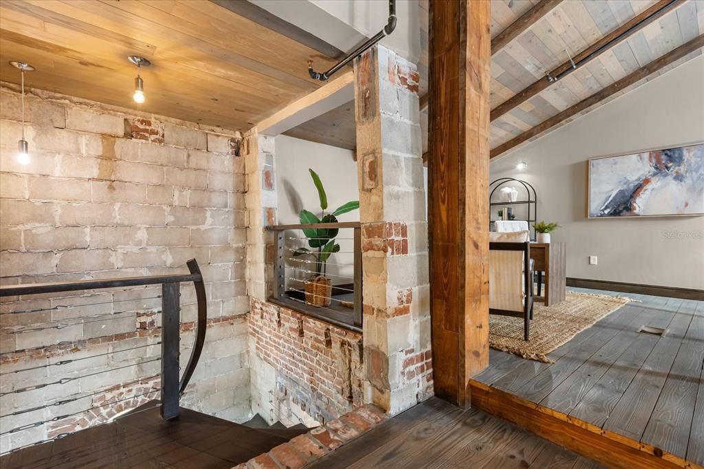 601 East Ridgewood Street Orlando, FL 32803 - Photo 48 of 86 a view of a hallway with wooden floor and staircase