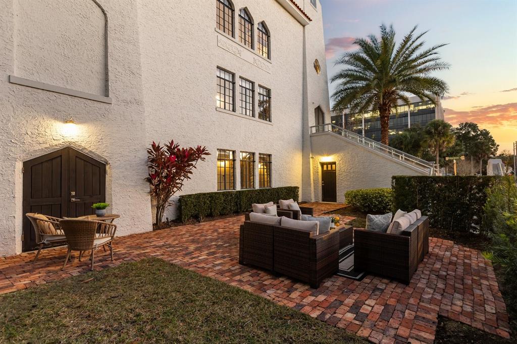 601 East Ridgewood Street Orlando, FL 32803 - Photo 64 of 86 a view of a patio with couches table and chairs and potted plants