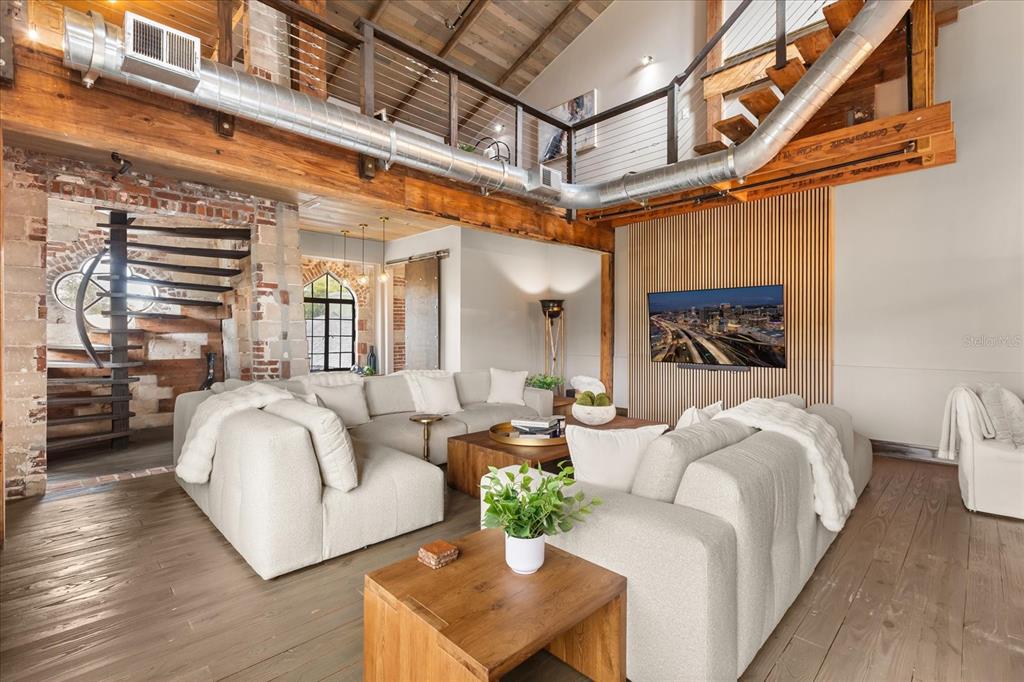 601 East Ridgewood Street Orlando, FL 32803 - Photo 8 of 86 a bedroom with furniture and a large window