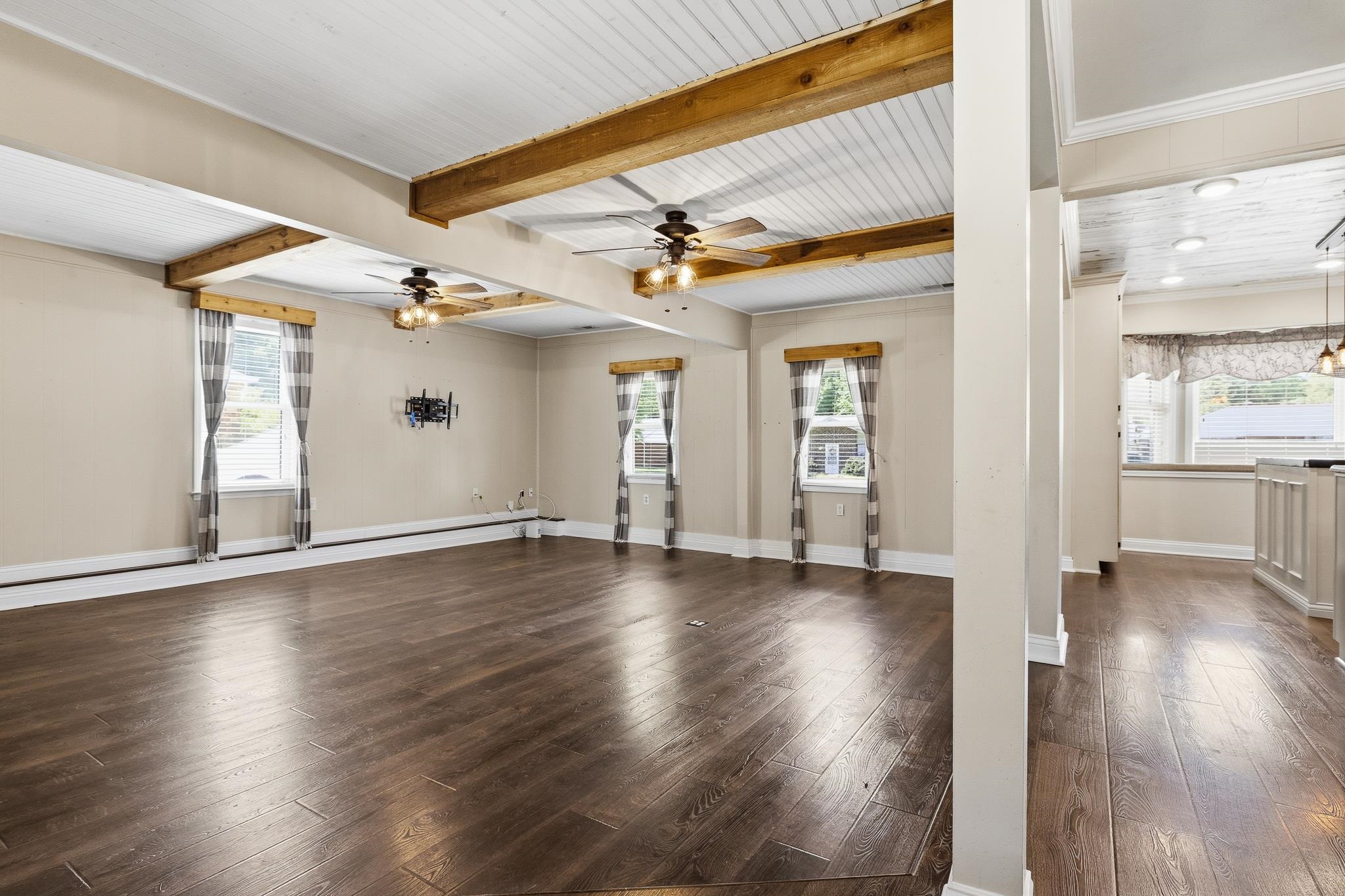 1234 Greenview Road Collierville, TN 38017 - Photo 5 of 33 an empty room with wooden floor and windows
