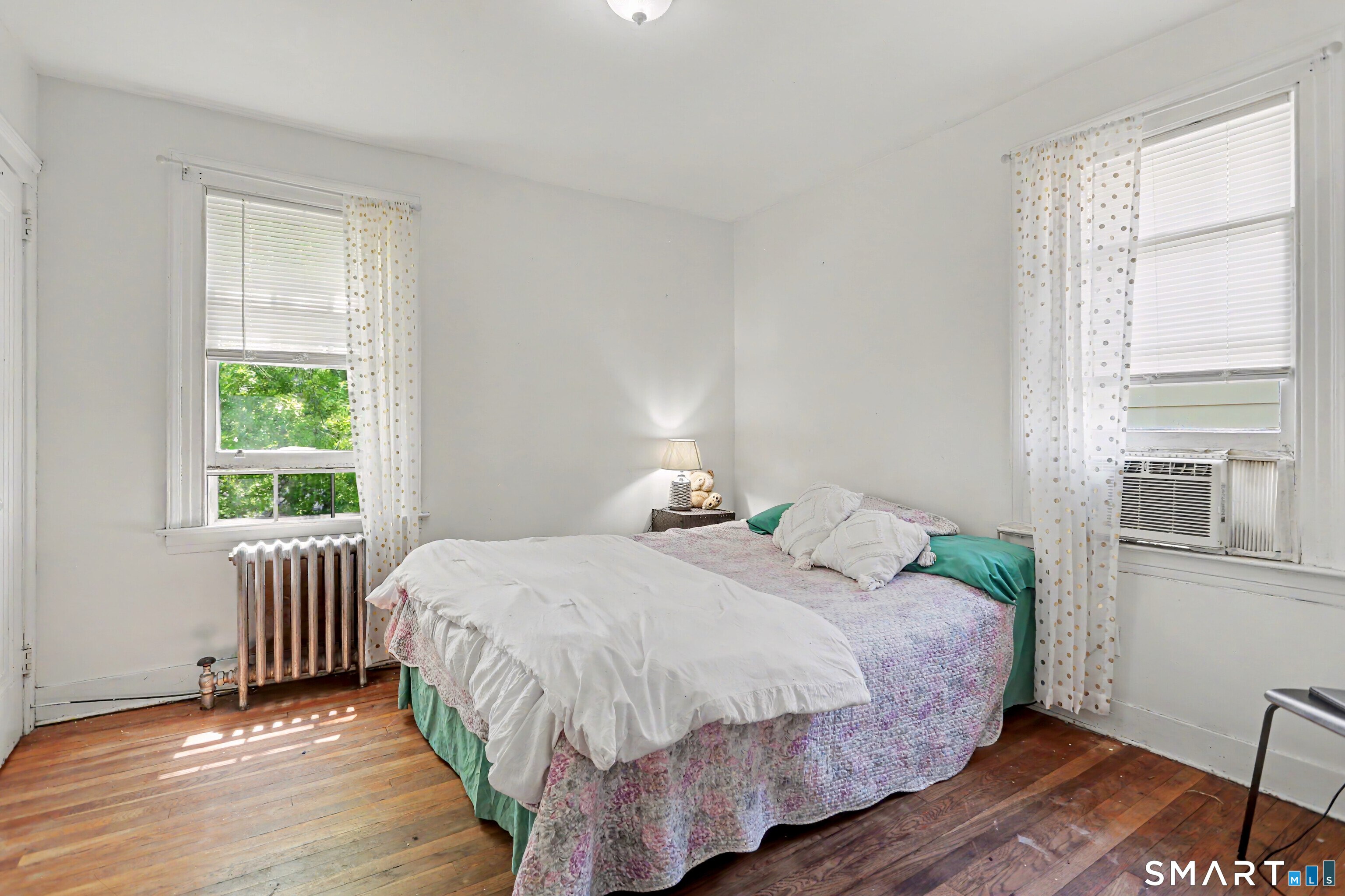 94 2nd Street Hamden, CT 06514 - Photo 18 of 31 a bedroom with a bed and a window
