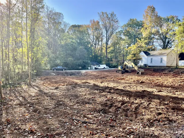 a bench is sitting in middle of the yard