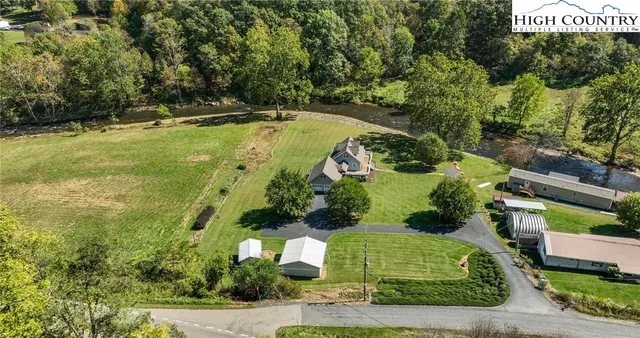 a view of a house with a big yard