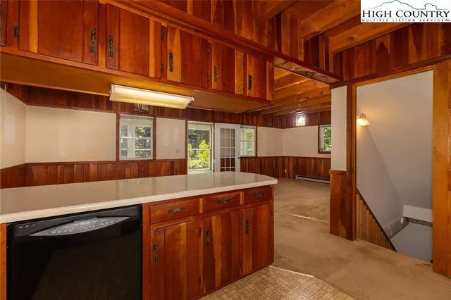 a kitchen with stainless steel appliances granite countertop a sink and a cabinets