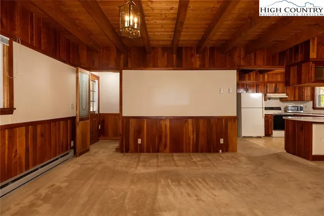 a view of an empty room with a garage