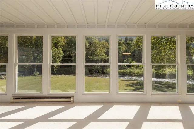 a view of an empty room with windows