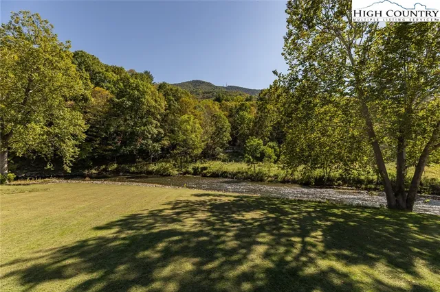 a view of a lake with a yard