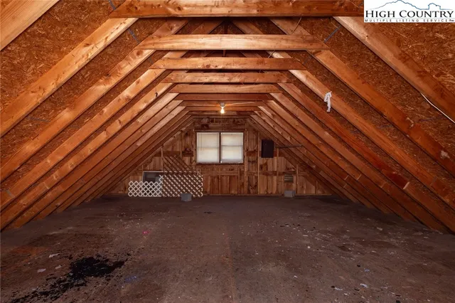 a view of a house with backyard porch and sitting area