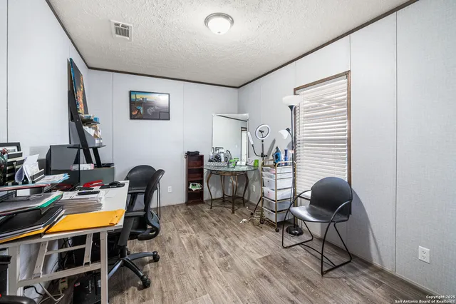 a bedroom with a bed and a book shelf