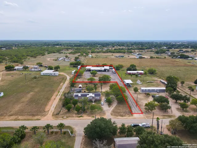 an aerial view of a city with lots of residential buildings in ocean
