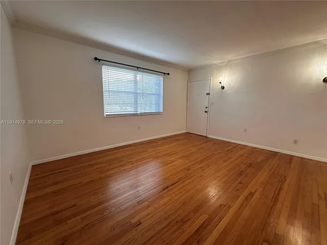 a view of a livingroom with wooden floor