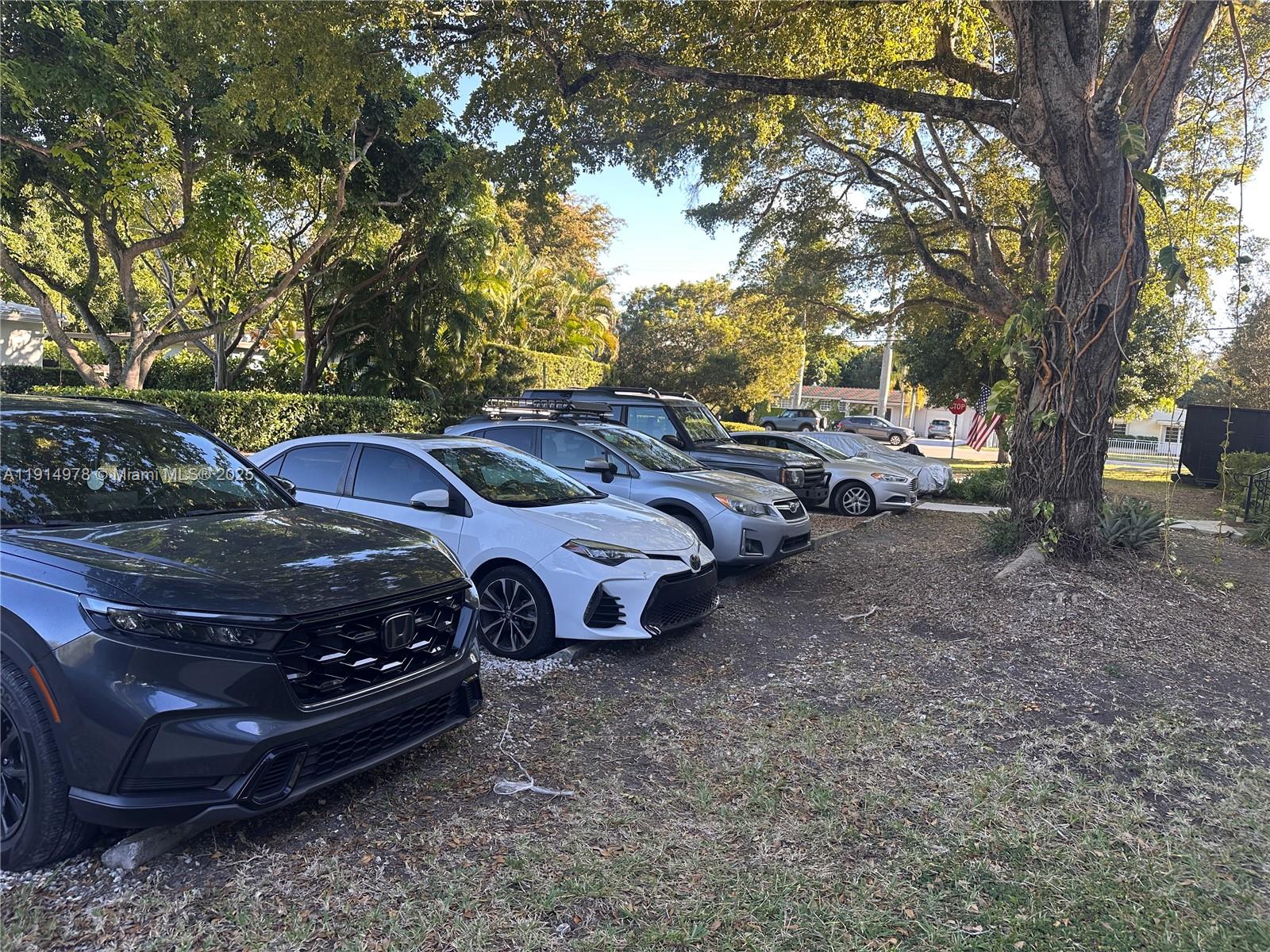 7940 Southwest 55th Avenue, Unit 67D Miami, FL 33143 - Photo 16 of 16 a view of a yard with car parked