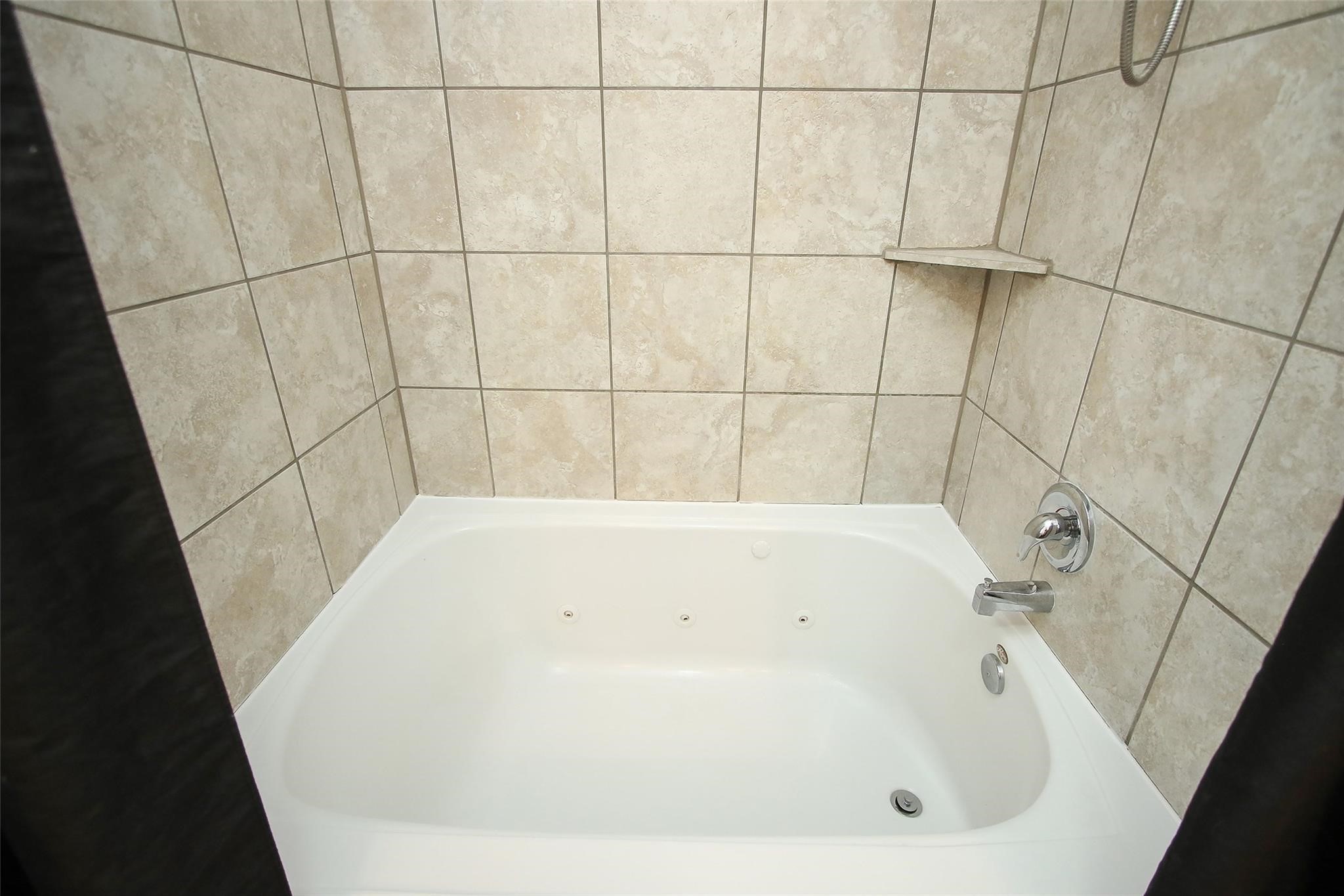 8517 Sunset Loch Drive Spring, TX 77379 - Photo 17 of 22 a bathroom with a bathtub