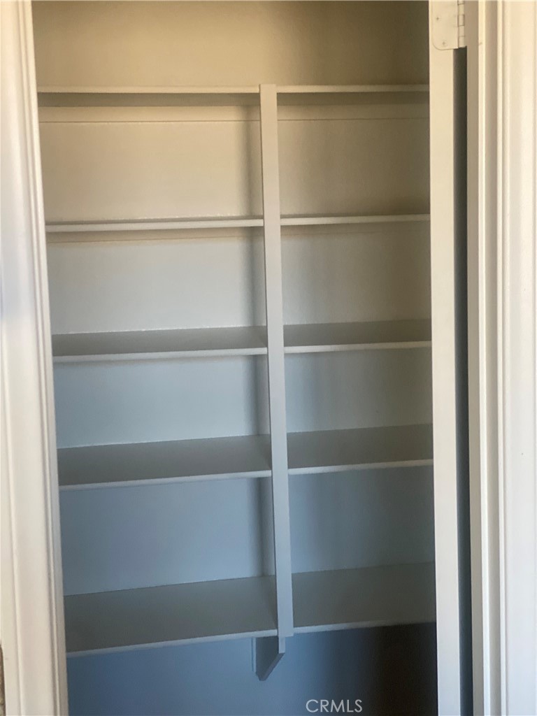 45954 Meritage Lane Coachella, CA 92236 - Photo 6 of 11 a view of an empty walk in closet with empty racks