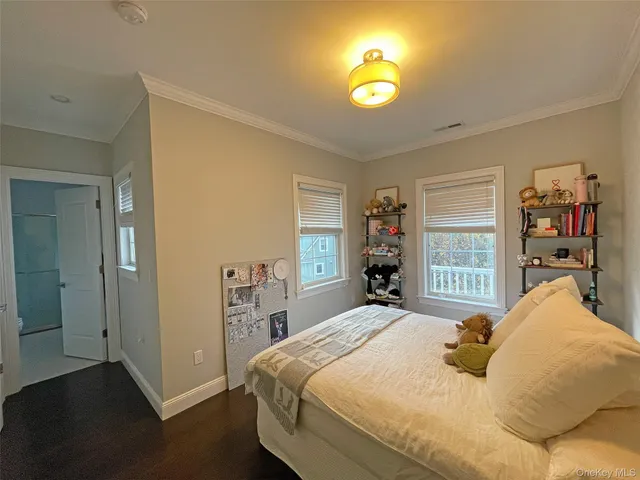 a bathroom with a double vanity sink a mirror and a bathtub