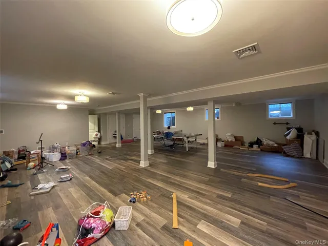 a bathroom with a toilet sink vanity and mirror