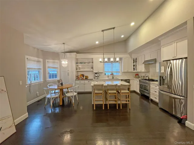 a kitchen with lots of counter top space and stainless steel appliances