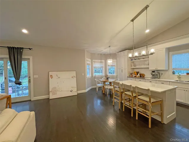 a large kitchen with lots of counter space a sink and appliances