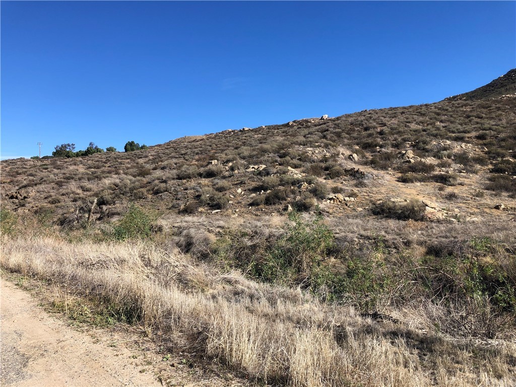 a view of a large building with mountains in the background