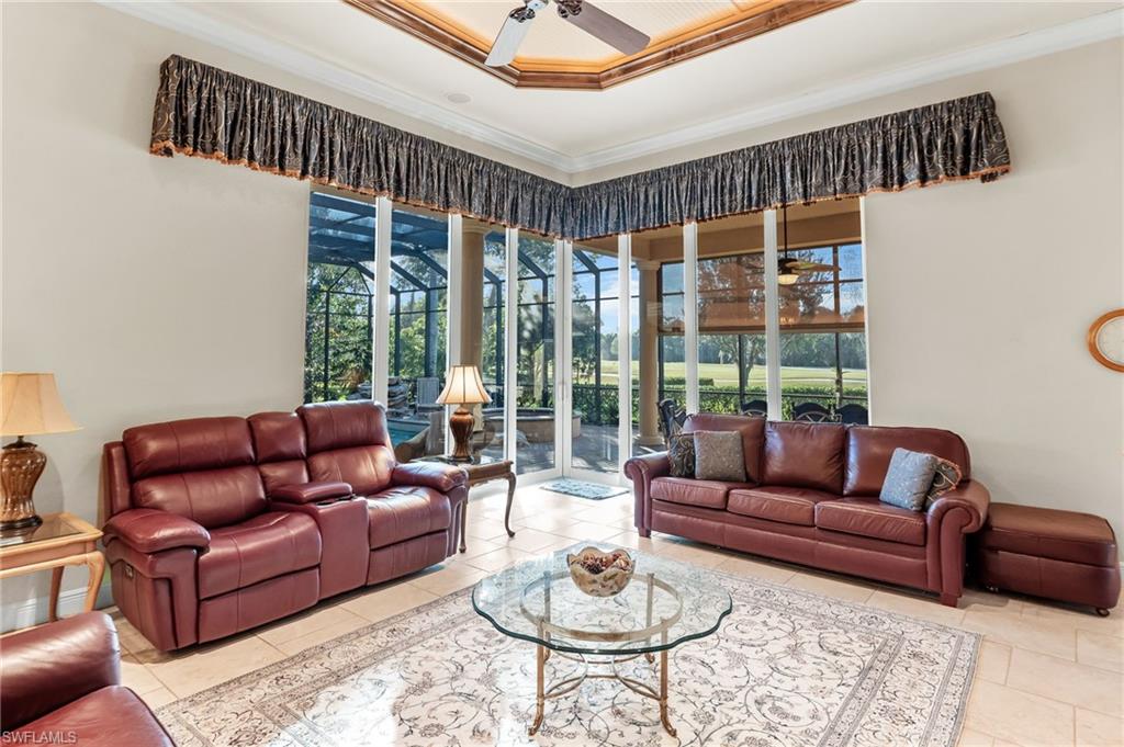 7615 Palmer Court Naples, FL 34113 - Photo 18 of 50 Living area with ceiling fan and crown molding