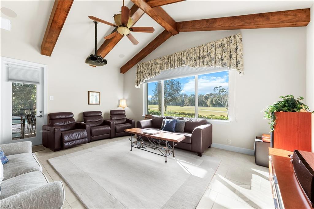 7615 Palmer Court Naples, FL 34113 - Photo 20 of 50 Living area featuring a ceiling fan, view of golf course, plenty of natural light, and light tile patterned floors