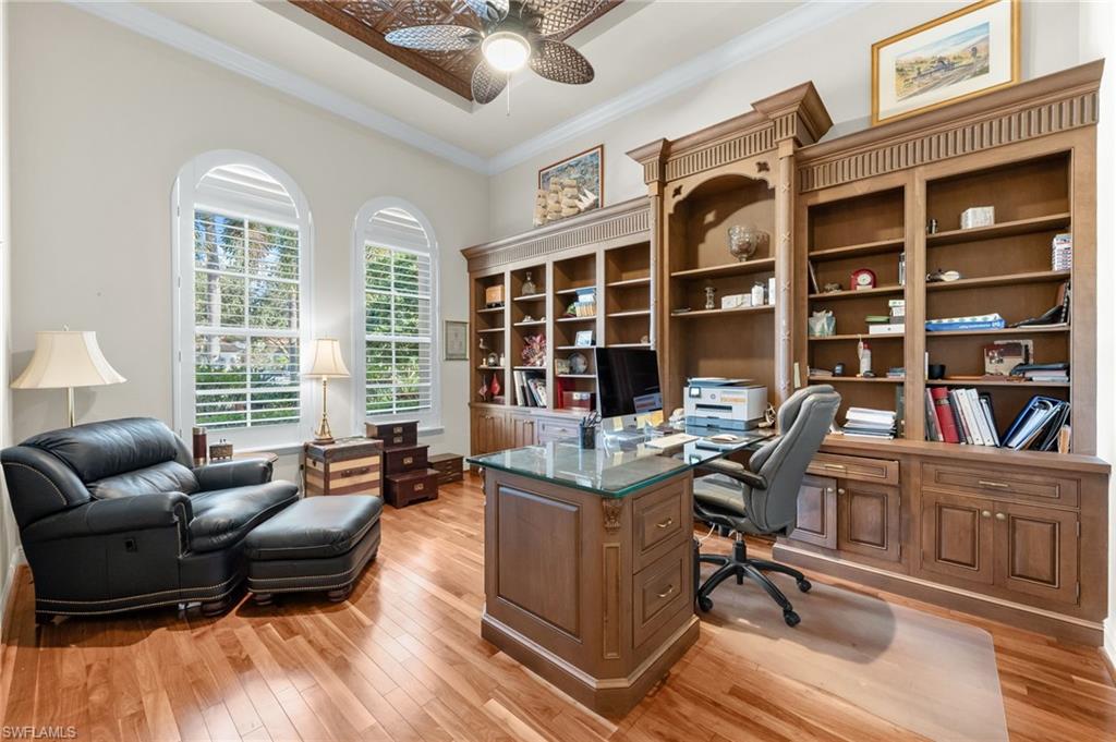 7615 Palmer Court Naples, FL 34113 - Photo 26 of 50 Office featuring a ceiling fan, light wood-style flooring, and crown molding