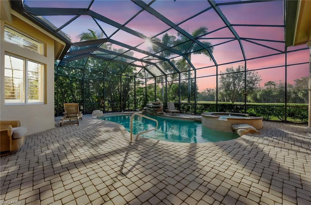 7615 Palmer Court Naples, FL 34113 - Photo 37 of 50 Combined pool / hot tub with a patio, a sunroom, and a lanai