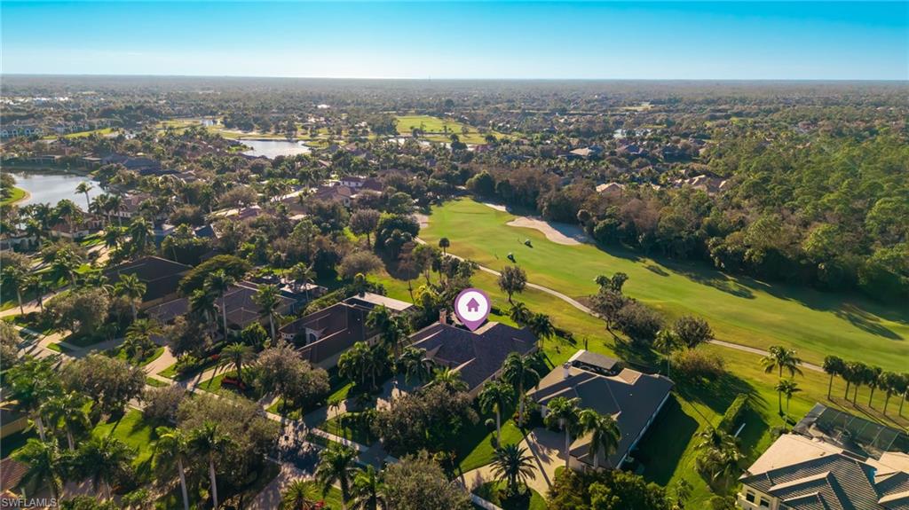 7615 Palmer Court Naples, FL 34113 - Photo 43 of 50 Aerial overview of property's location featuring nearby suburban area, a golf course, and a nearby body of water