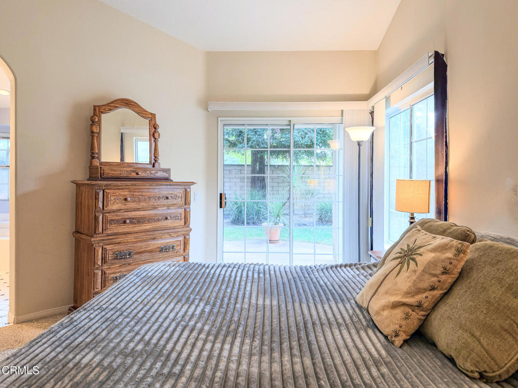 2300 Bayhill Court Oxnard, CA 93036 - Photo 13 of 28 a bedroom with a bed and a dresser next to a window