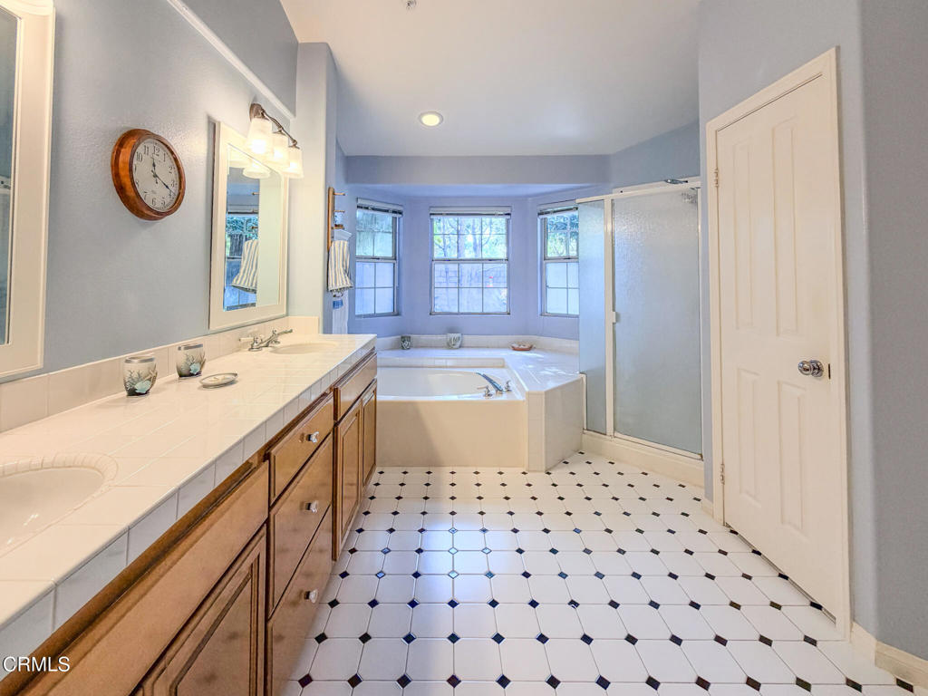 2300 Bayhill Court Oxnard, CA 93036 - Photo 15 of 28 a bathroom with a sink a bathtub and a shower