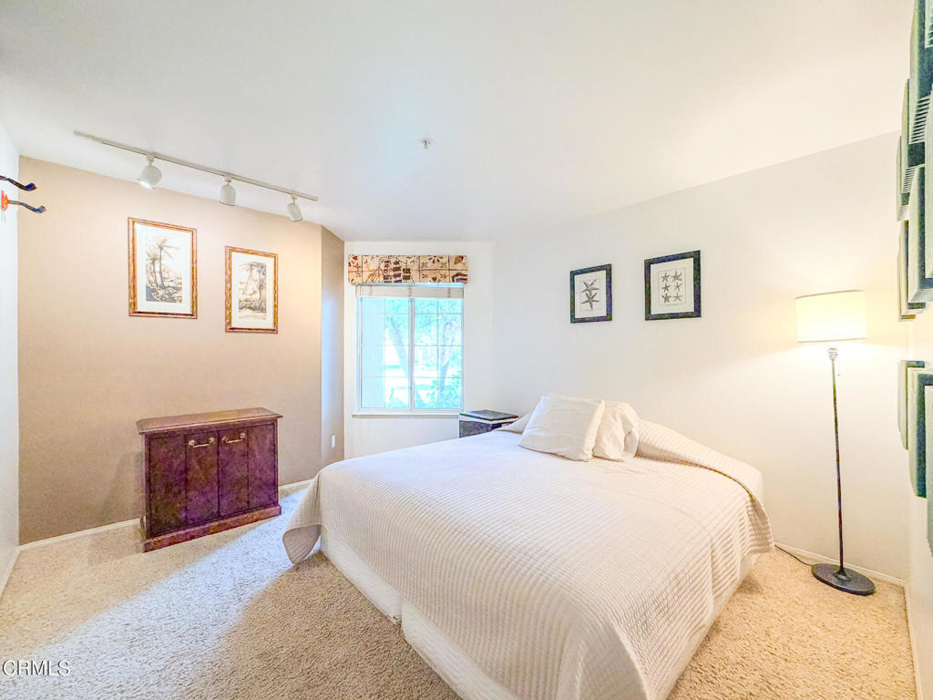 2300 Bayhill Court Oxnard, CA 93036 - Photo 16 of 28 a bedroom with a large bed and a window