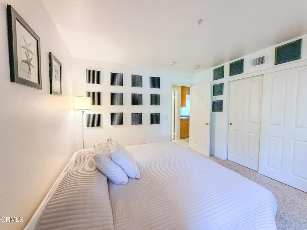 2300 Bayhill Court Oxnard, CA 93036 - Photo 18 of 28 a bedroom with a bed and a walk in closet