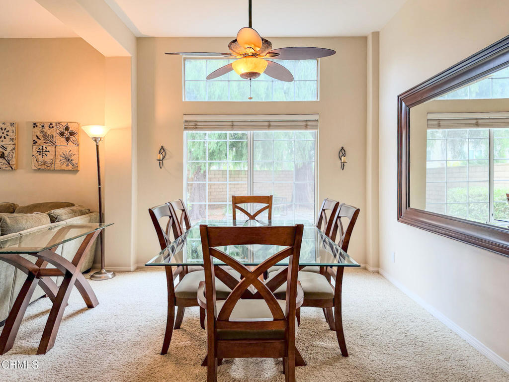2300 Bayhill Court Oxnard, CA 93036 - Photo 23 of 28 a dining room table with chairs and window