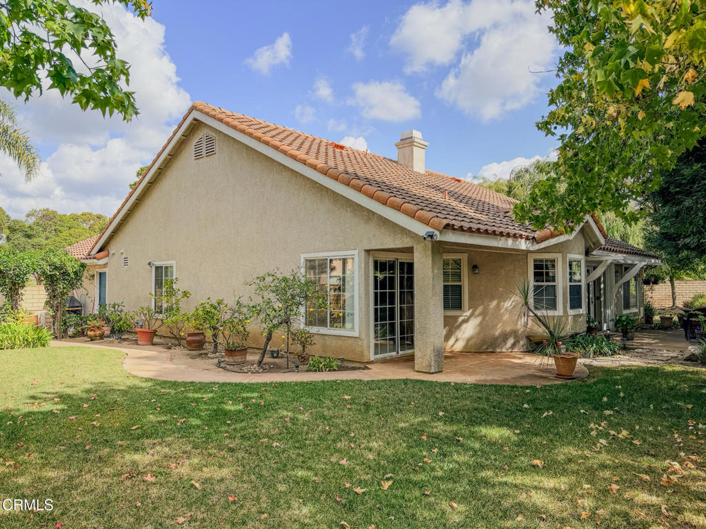 2300 Bayhill Court Oxnard, CA 93036 - Photo 27 of 28 a front view of house with a garden and trees
