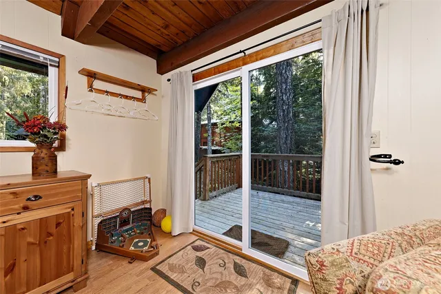 a bedroom with balcony and furniture