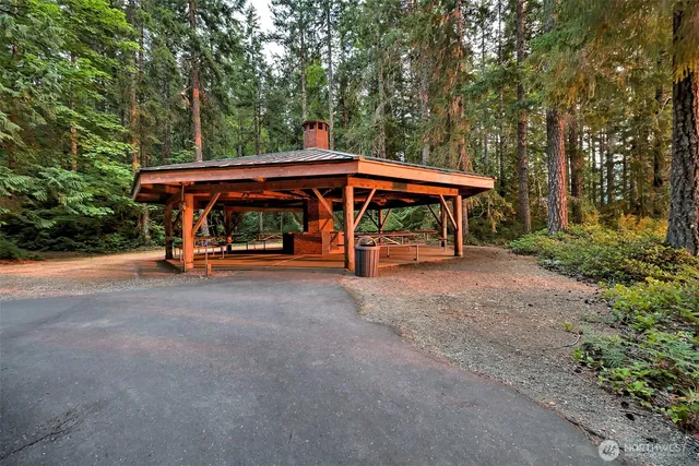 a view of patio with a table and chairs under an umbrella
