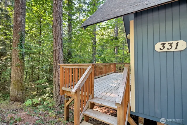 a view of a two chairs in the balcony