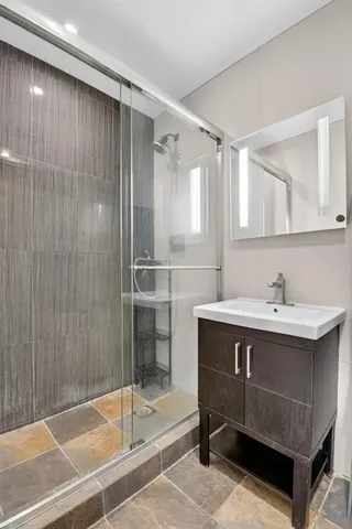 a bathroom with a sink and a mirror