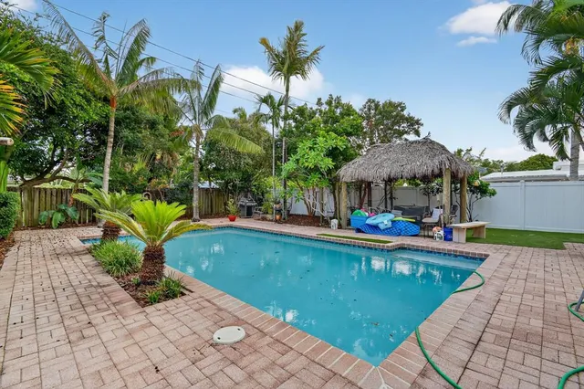 a view of a swimming pool with a patio