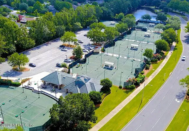 an aerial view of residential houses with outdoor space