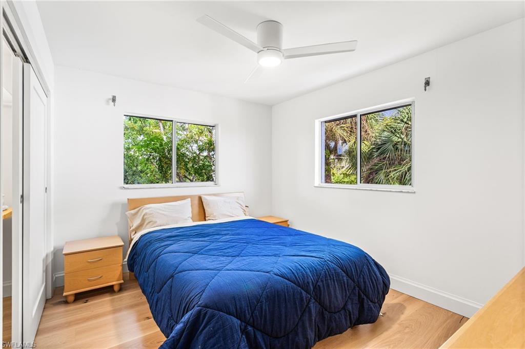 27682 Imperial River Road, Unit CH2 Bonita Springs, FL 34134 - Photo 13 of 26 a bedroom with a bed and a window