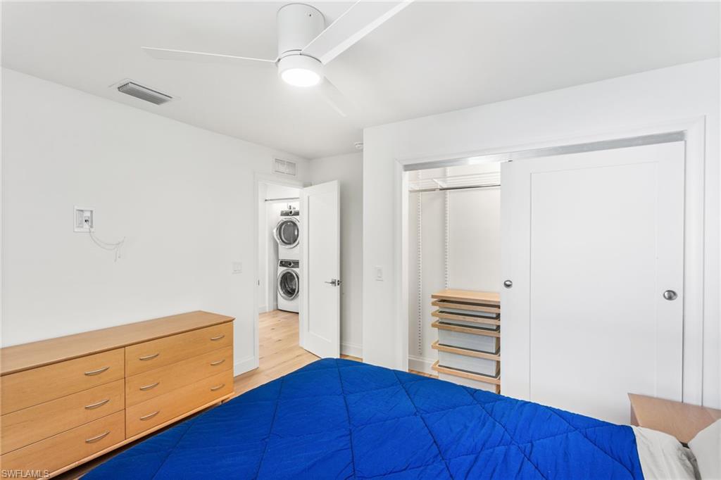 27682 Imperial River Road, Unit CH2 Bonita Springs, FL 34134 - Photo 14 of 26 a view of kitchen with wooden floor and cabinets
