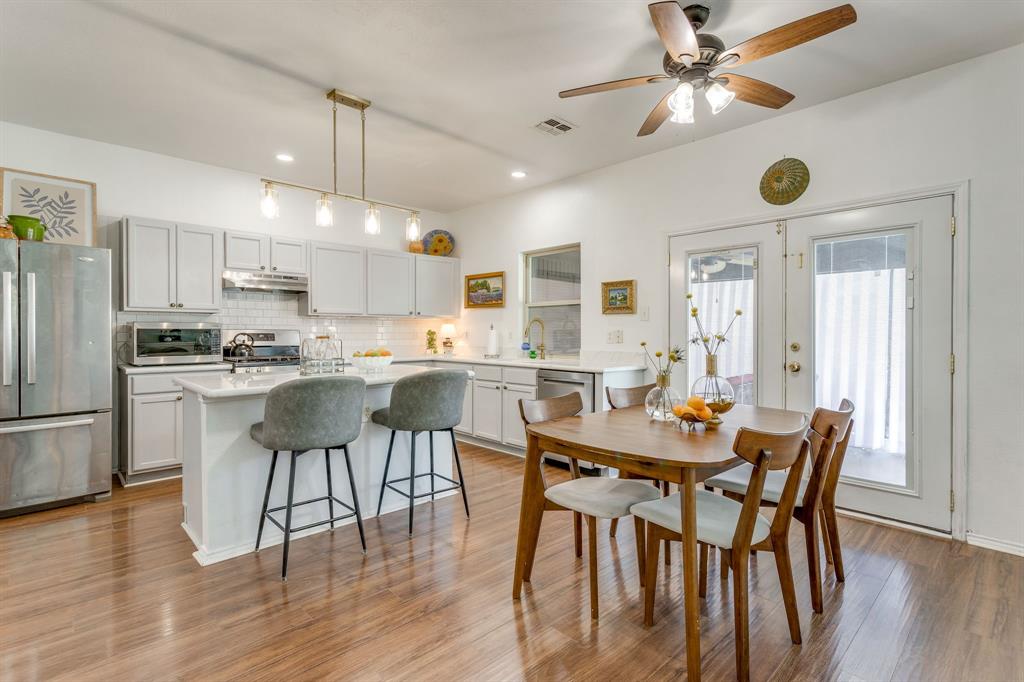 4816 Sleepy Ridge Circle Fort Worth, TX 76133 - Photo 13 of 36 Dining space with light wood-type flooring, ceiling fan, and french doors