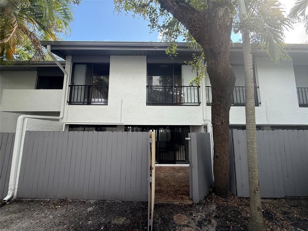 19428 Northeast 26th Avenue, Unit 103 Miami, FL 33180 - Photo 12 of 65 a view of back yard of the house