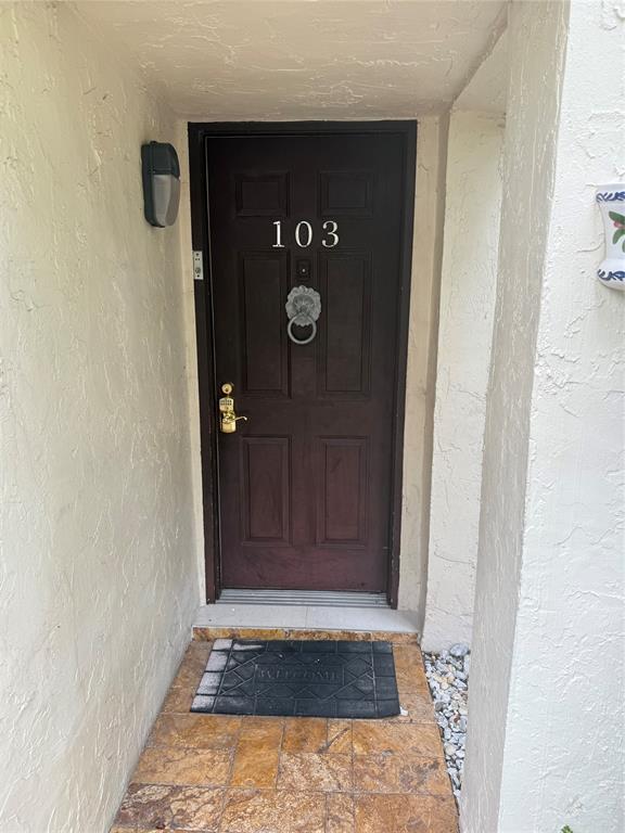 19428 Northeast 26th Avenue, Unit 103 Miami, FL 33180 - Photo 2 of 65 a view of an entryway door
