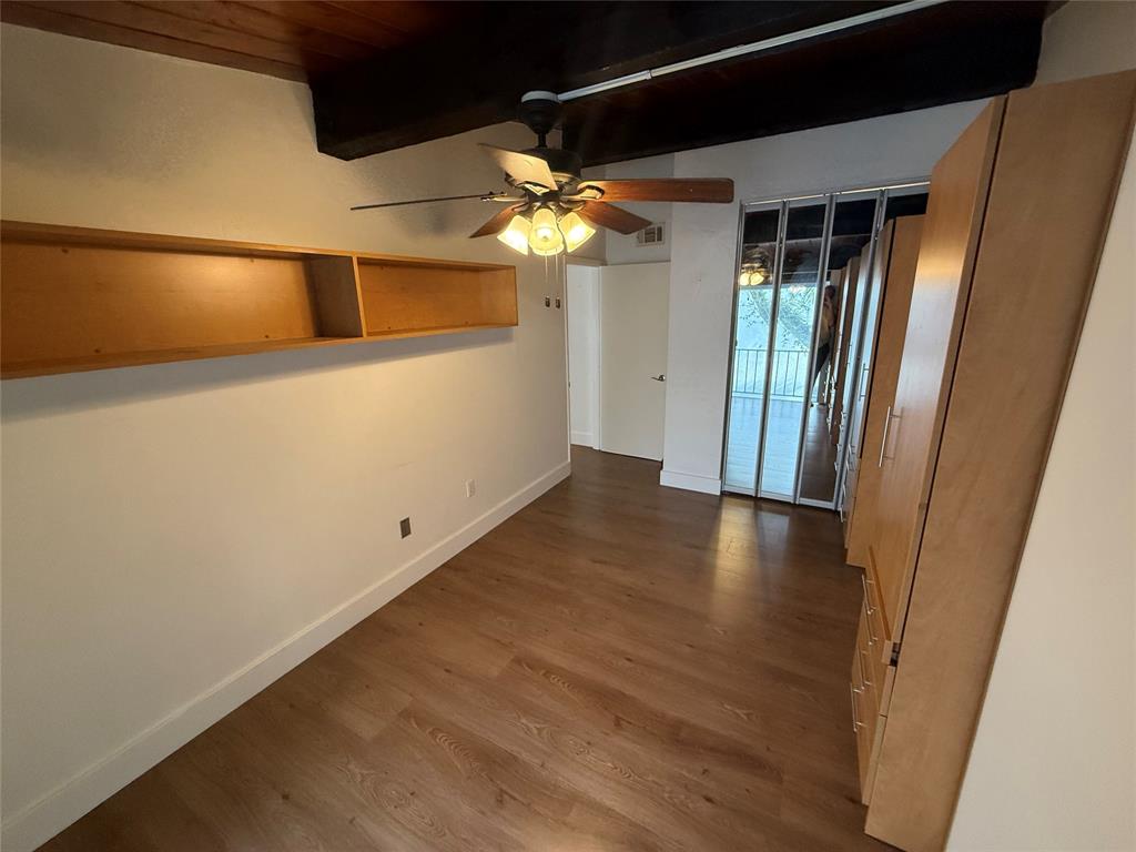 19428 Northeast 26th Avenue, Unit 103 Miami, FL 33180 - Photo 36 of 65 a view of a hallway with wooden floor