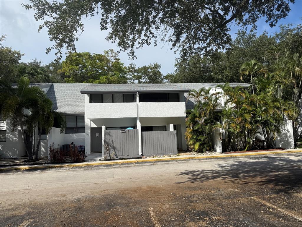 19428 Northeast 26th Avenue, Unit 103 Miami, FL 33180 - Photo 60 of 65 a view of a house with a outdoor space