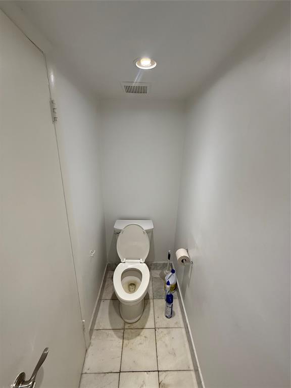 19428 Northeast 26th Avenue, Unit 103 Miami, FL 33180 - Photo 7 of 65 a bathroom with a toilet