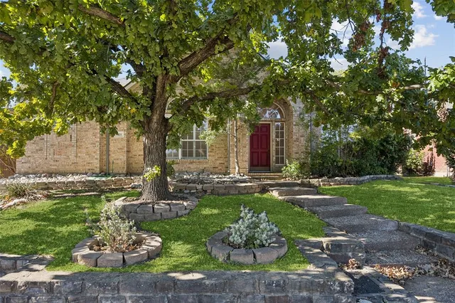 a view of a garden with patio