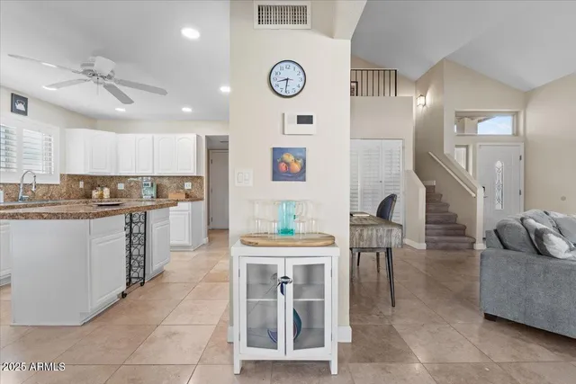 a living room with furniture and a table